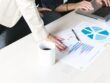 office-woman-hands-on-report